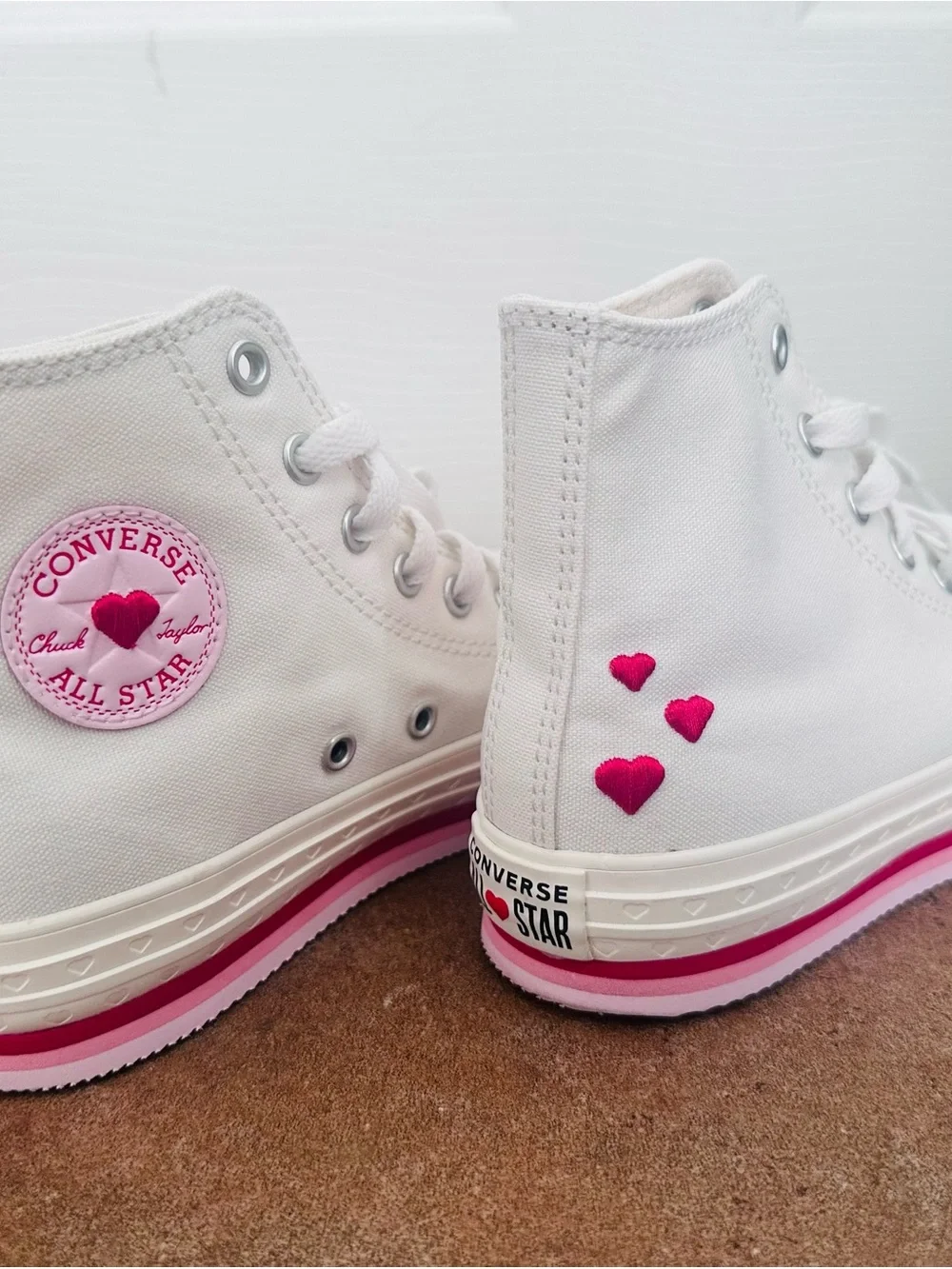 Converse White High-Top Sneakers with Pink Accents